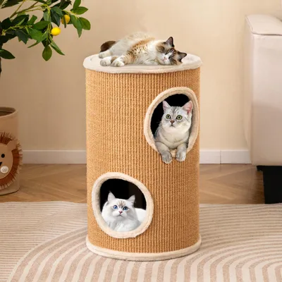 Three cats are interacting with a multi-level cat scratching post and hideaway.