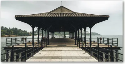 Produktbild von Tulup® Glas-Bild - 100x50 -Wandkunst - Wandbild hinter gehärtetem Sicherheitsglas  - Sehenswürdigkeiten & Architektur - Pier in Hong Kong - Braun