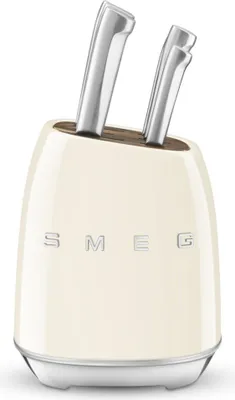 A cream-colored knife block with silver handles of knives protruding from the top.