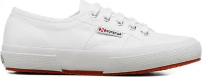 A white Superga sneaker with a red sole is shown against a white background.