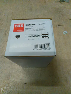 A cardboard box with product information and a barcode.
