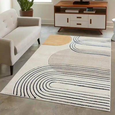 A modern living room with a sofa and a rug.