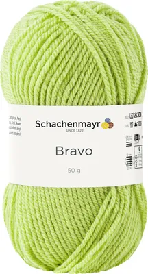 A ball of light green yarn with a white label.