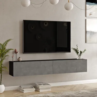A modern living room with a wall-mounted TV stand and television.
