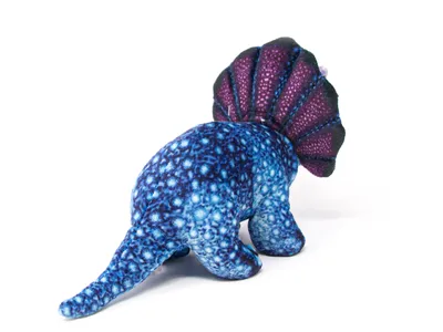 A plush toy dinosaur on a white background.