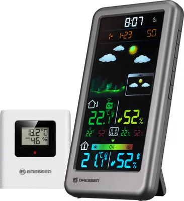 A digital weather station with a separate sensor unit, displayed on a white background.