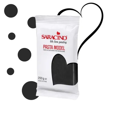 A package of Saracino Pasta Modellare (modeling paste) in black, with decorative elements like black circles and a heart outline.