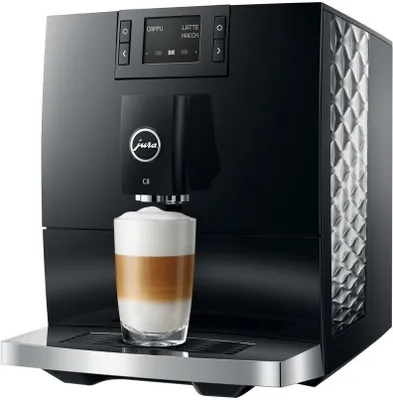 A black Jura C8 coffee machine is shown with a latte macchiato being dispensed into a glass.