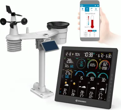 A weather station with a display screen and a smartphone showing weather data.