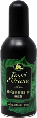 A bottle of Tesori D'Oriente perfume with a label featuring green leaves and brand information.