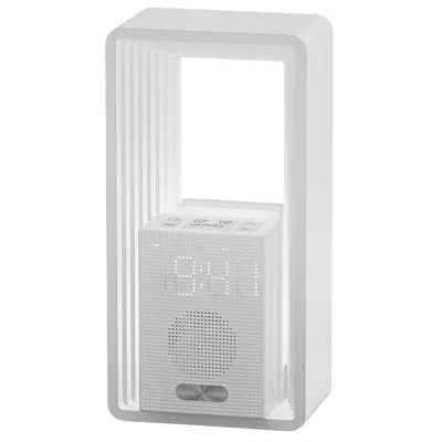 A white sunrise alarm clock with a digital display and speaker is shown against a white background.
