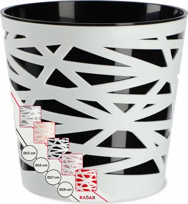 A white and black patterned plant pot with size indicators on the side.