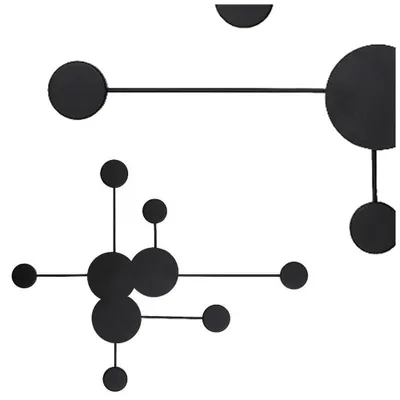 Abstract geometric wall art with black circles and lines on a white background.