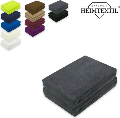 A collage of folded fabric items and a logo, with a larger folded fabric item in the foreground.
