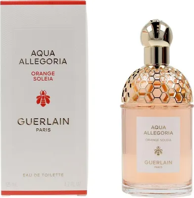 A perfume bottle and its packaging are displayed side-by-side against a white background.