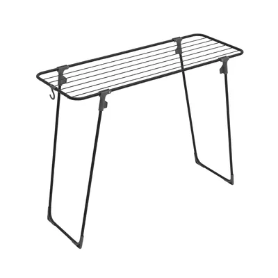 A black metal drying rack with multiple horizontal bars for hanging clothes.