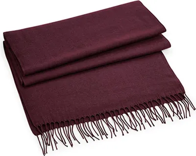 A folded burgundy scarf with fringe on a white background.