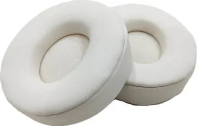 Two white ear pads for headphones are shown against a white background.