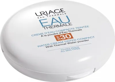 A white compact powder case with product branding and information.