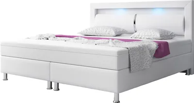 A modern white boxspring bed with integrated LED lighting.