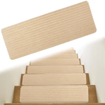 Zdjęcie produktu dla Maty antypoślizgowe - samoprzylepne - wielokrotnego użytku - beżowe - 15 sztuk - 55 x 22 cm - wykonane z wytrzymałego poliestru - nakładki na schody