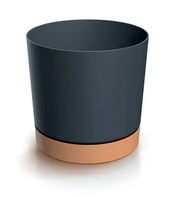 A dark gray cylindrical pot with a brown base sits on a white surface.