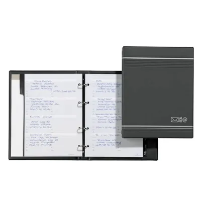 An open address book with pages filled with handwritten entries, next to its closed cover.