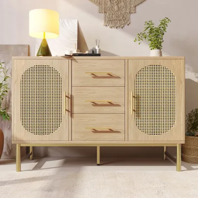 A light wood sideboard with rattan doors and gold accents, displayed in a well-lit room with decorative items.