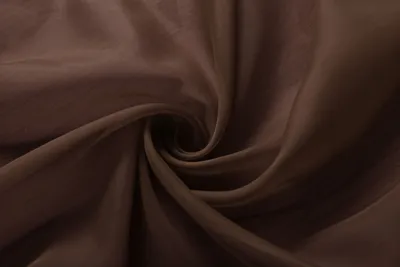 A close-up swirl of brown fabric.