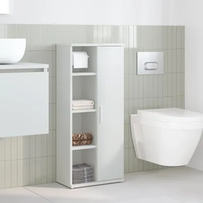 A modern bathroom with a wall-mounted toilet, a vanity with a sink, and a tall white storage cabinet.