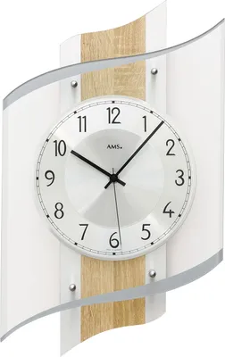 A modern wall clock with a curved design and wood accents.