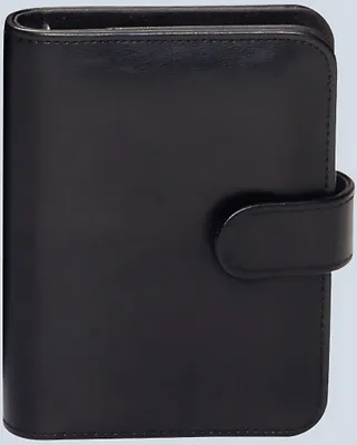 A closed black planner is shown against a light gray background.