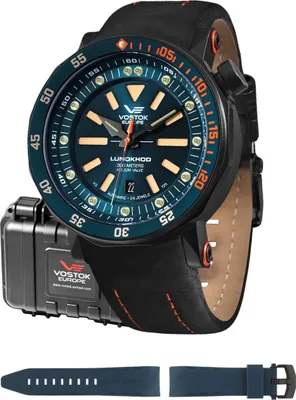 A Vostok Europe watch with its accessories laid out.