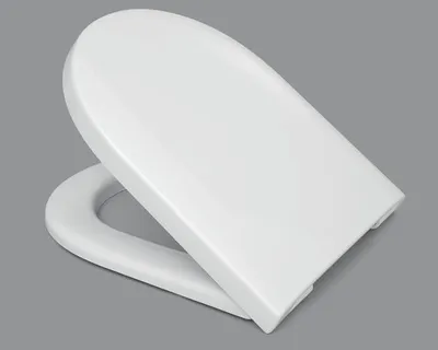 A white toilet seat is shown from a slightly elevated side angle against a plain gray background.