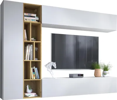 A modern white and wood entertainment center with a TV, shelves, and decorative items.