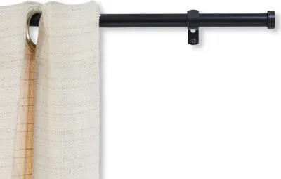 A close-up of a curtain rod with a beige curtain attached.