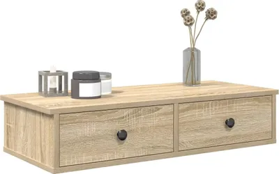 A wooden shelf with two drawers and decorative items on top.
