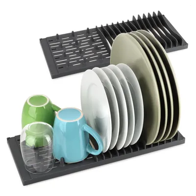 Two gray plastic dish racks, one with plates and the other with cups, are shown against a white background.