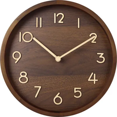 A close-up studio shot of a wooden wall clock.