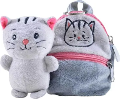 A plush cat toy next to a small plush backpack.