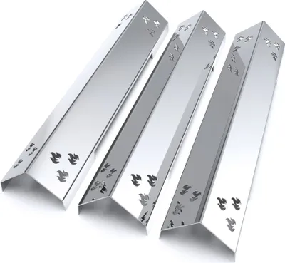 Three shiny metal grill burner covers are arranged diagonally on a white background.