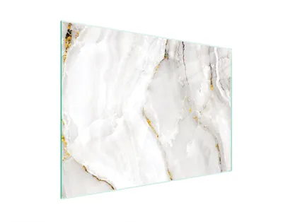 A glass cutting board with a marble pattern.