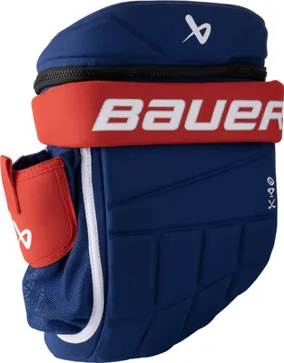 A close-up studio shot of a blue and red hockey glove backpack.