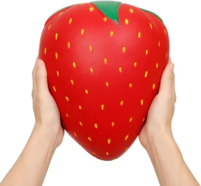Two hands holding a large strawberry-shaped squishy toy.