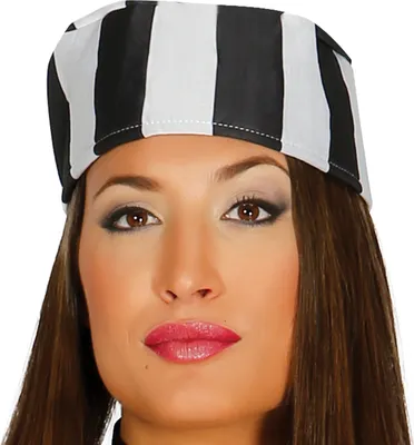 Close-up of a woman's face wearing a striped hat.