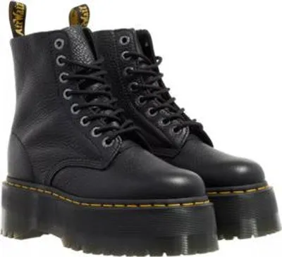 A pair of black Dr. Martens platform boots.