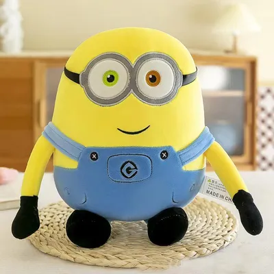 Produktbild von Minions Bob Plüschtier 25 cm, gelbe Kuschelfigur mit Brille & blauer Latzhose, weiche Comic Plüschfigur