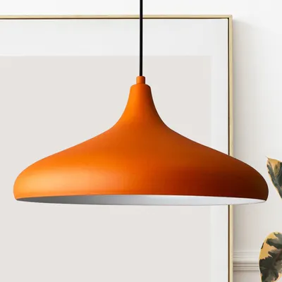 A close-up shot of an orange pendant light.