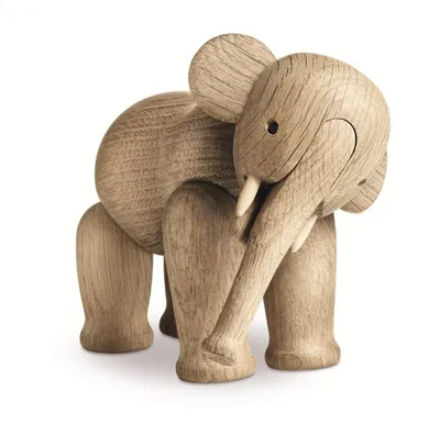 A wooden elephant figurine on a white background.