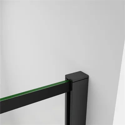 A close-up view of a black shower enclosure frame with a green glass panel, mounted against a white wall.